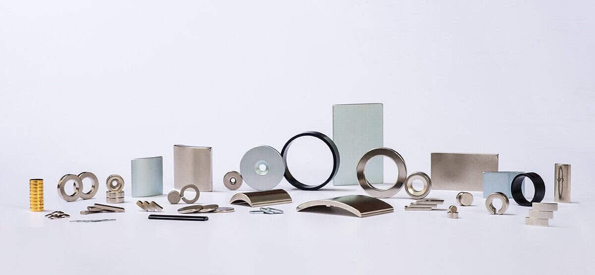 Real NdFeB product range including rings, arc segments, discs, blocks, and finished magnetic parts