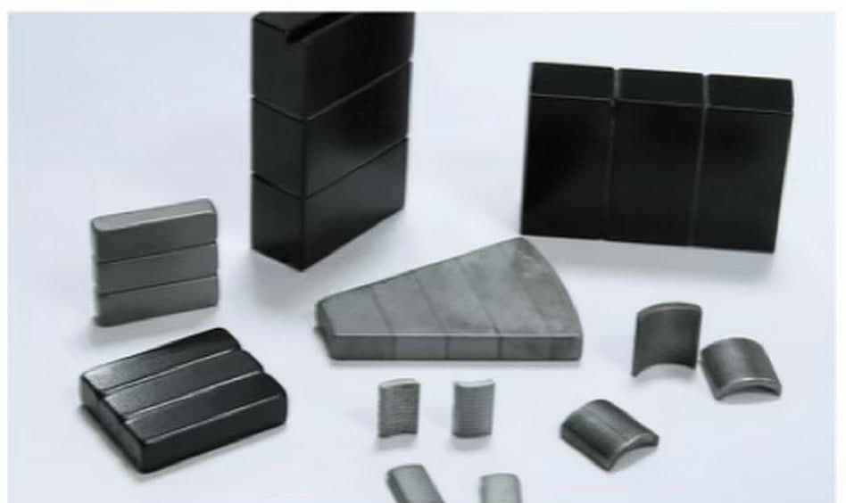 Laminated magnet stacks, arc segments, and blocks across coatings